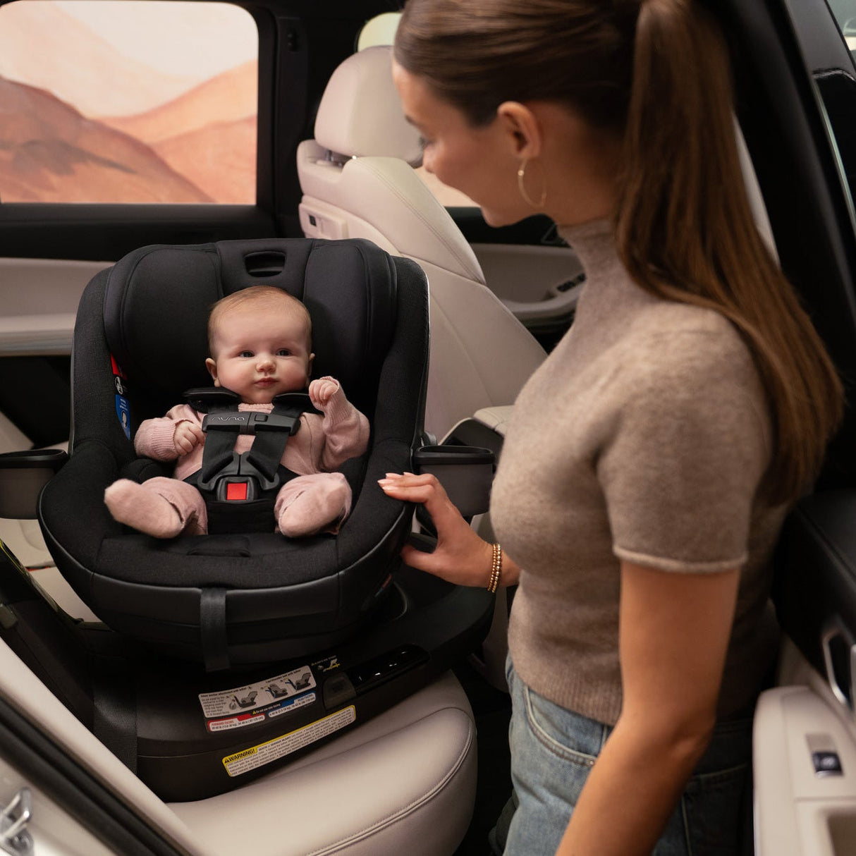 NUNA REVV Maxx Rotating Convertible Car Seat with cupholder